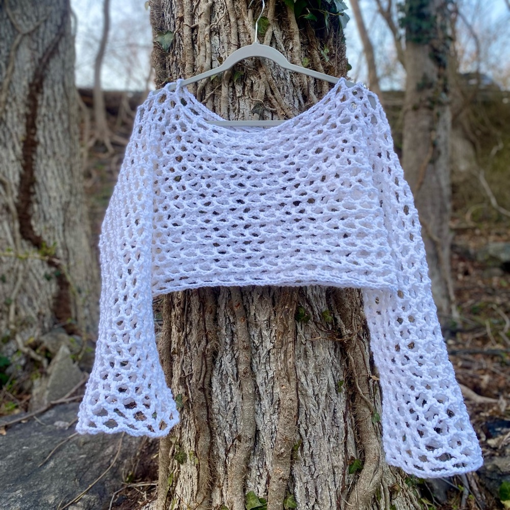 Crocheted white mesh top with long sleeves